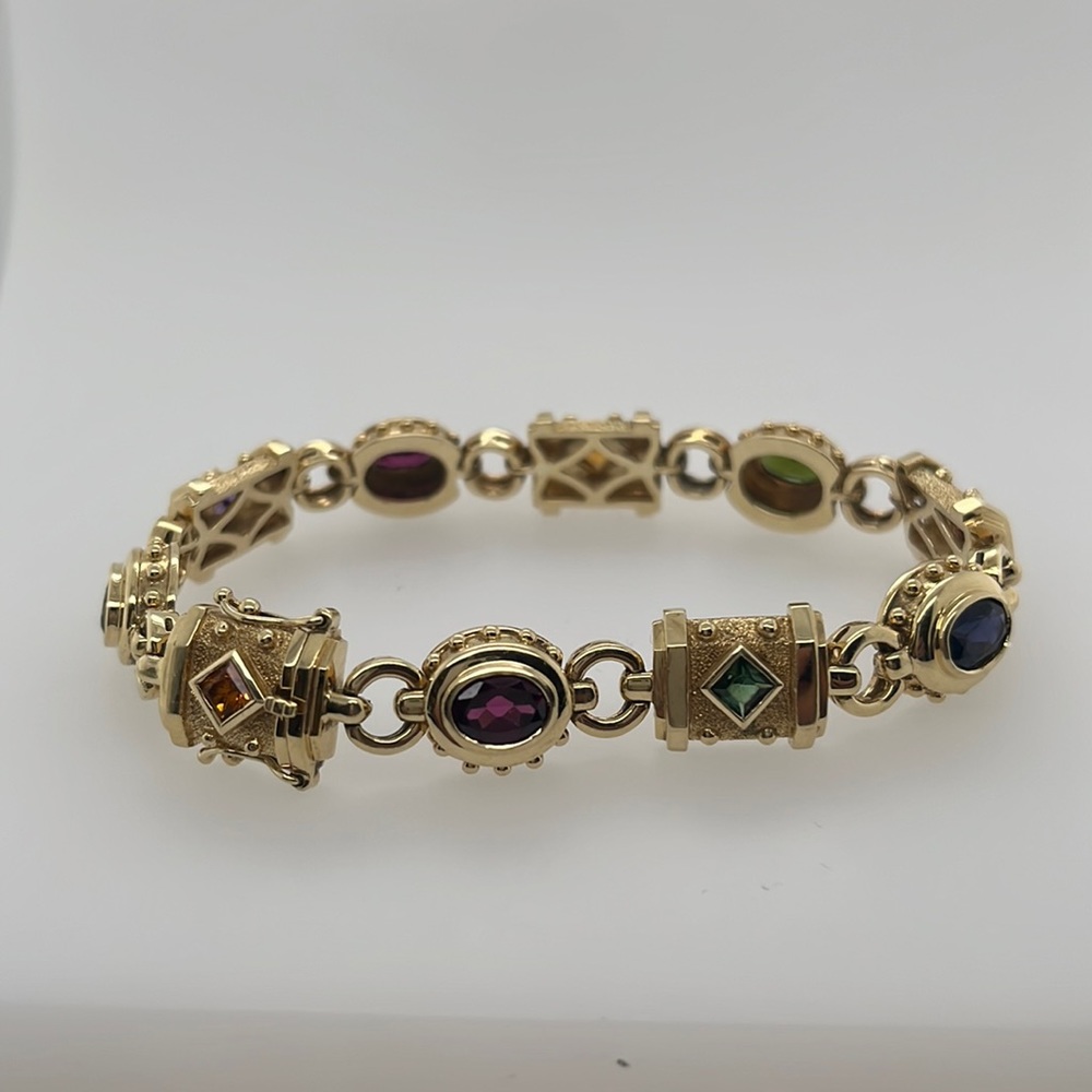 14k yellow gold genuine multi colored gemstones bracelet .